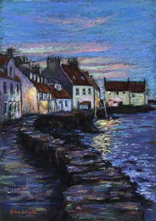 Looking along the West Shore at Pittenweem with the last colours of sunset in the sky and the lights reflecting in the sea